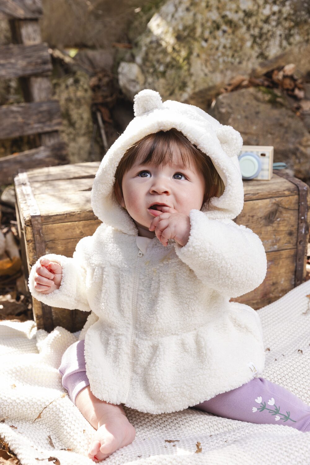 Toddler in a Deux par Deux fuzzy hooded coat
