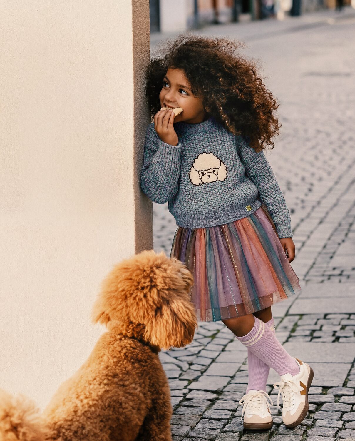 Girl in a Deux par Deux tulle skirt with a poodle