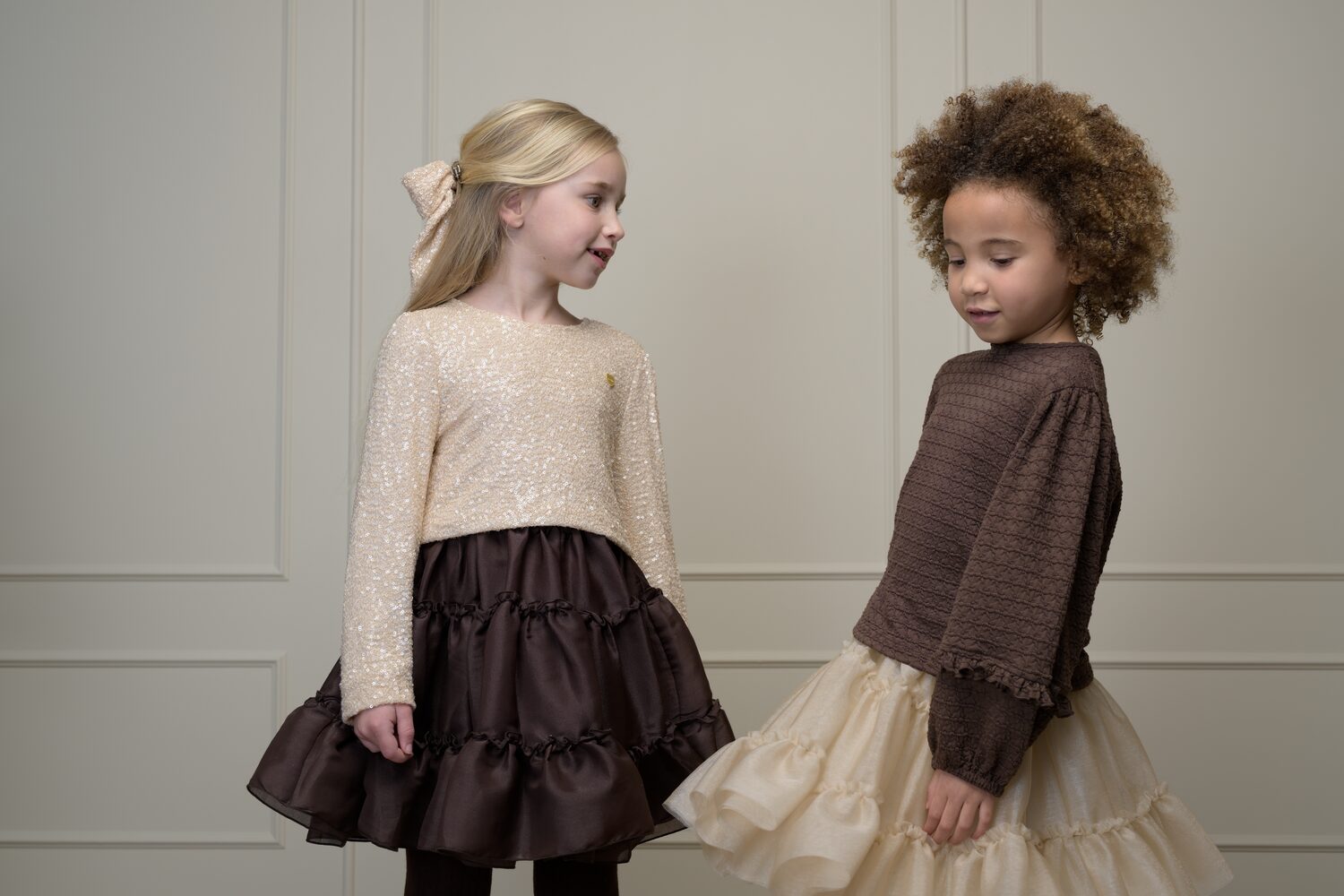 Two girls in Le Chic occasion dresses