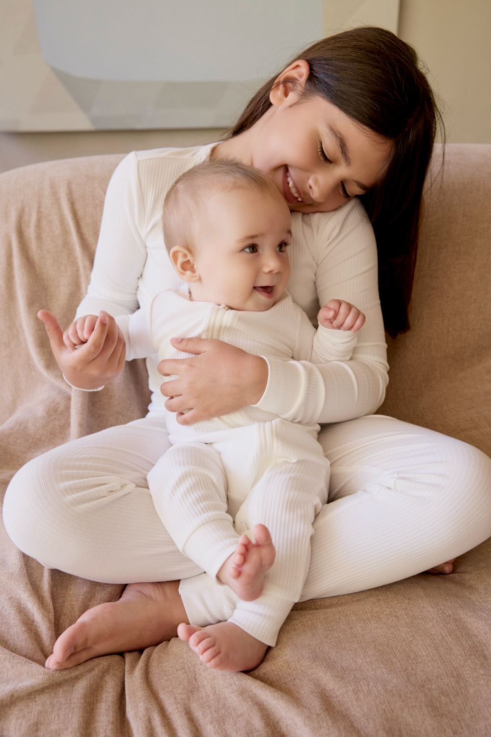 Baby and adult in matching Petit Lem ivory ribbed loungewear